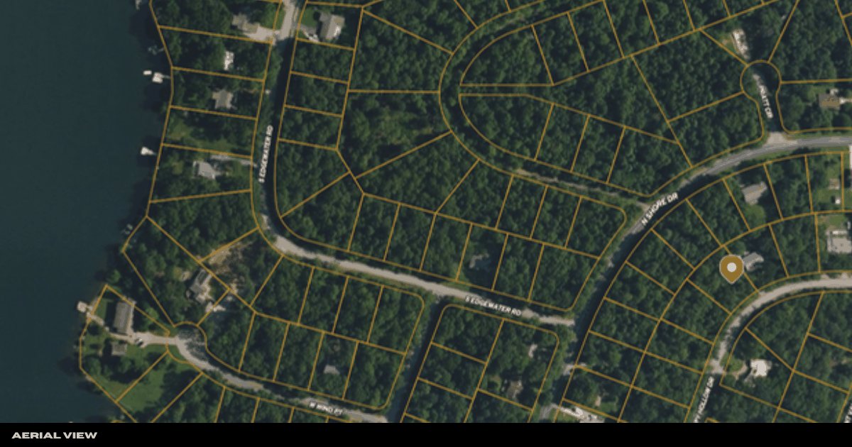 Aerial view with a pin marking the parcel within the North Shore neighborhood near Crown Lake
