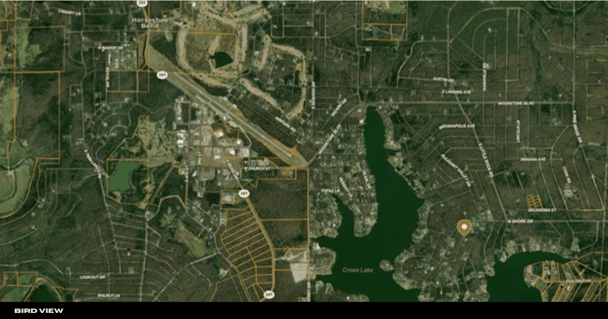 Wide bird’s-eye satellite view of the Horseshoe Bend area around the parcel and Crown Lake